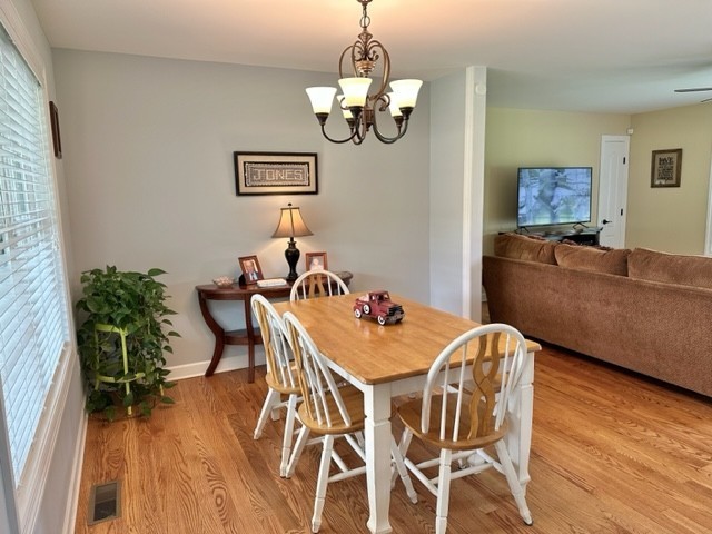 2244 Baptist Branch Road Mount Pleasant, TN 38474 - Photo 34 of 47 a view of a dining room with furniture wooden floor and chandelier
