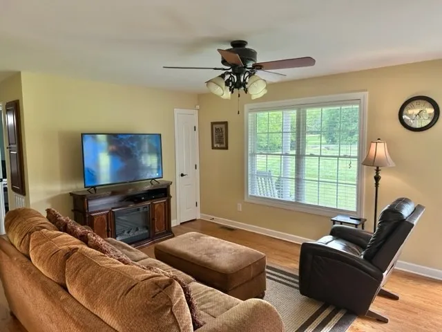 a living room with furniture and a window