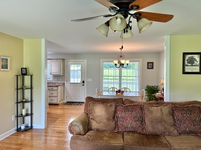 2244 Baptist Branch Road Mount Pleasant, TN 38474 - Photo 40 of 47 a living room with furniture a chandelier and a window