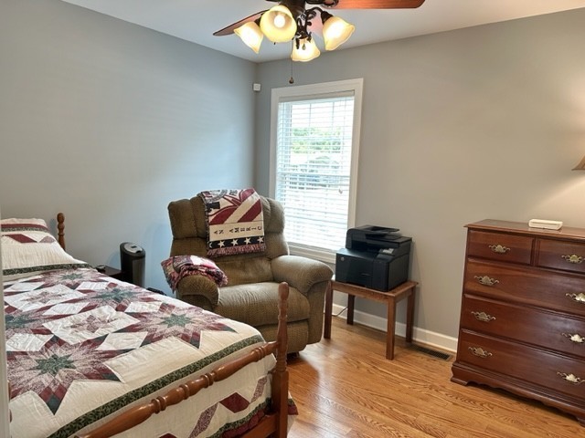 2244 Baptist Branch Road Mount Pleasant, TN 38474 - Photo 43 of 47 a bedroom with a bed and chair