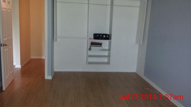904 Ridge Square, Unit 105 Elk Grove Village, IL 60007 - Photo 12 of 12 a view of a room with wooden floor