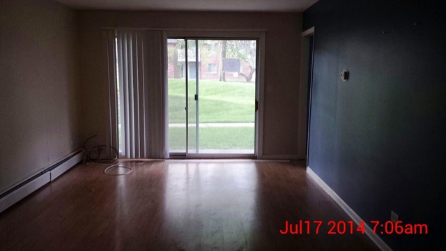 904 Ridge Square, Unit 105 Elk Grove Village, IL 60007 - Photo 3 of 12 a view of an entryway with wooden floor