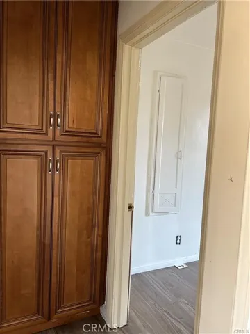 an empty room with wooden floor