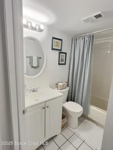 a bathroom with a toilet a sink and a mirror
