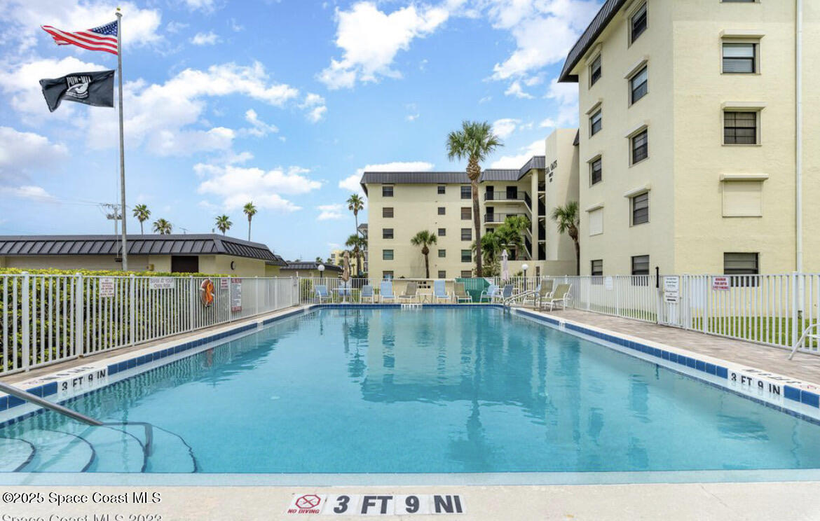 4570 Ocean Beach Boulevard, Unit 104 Cocoa Beach, FL 32931 - Photo 18 of 18 a view of a balcony with an ocean view