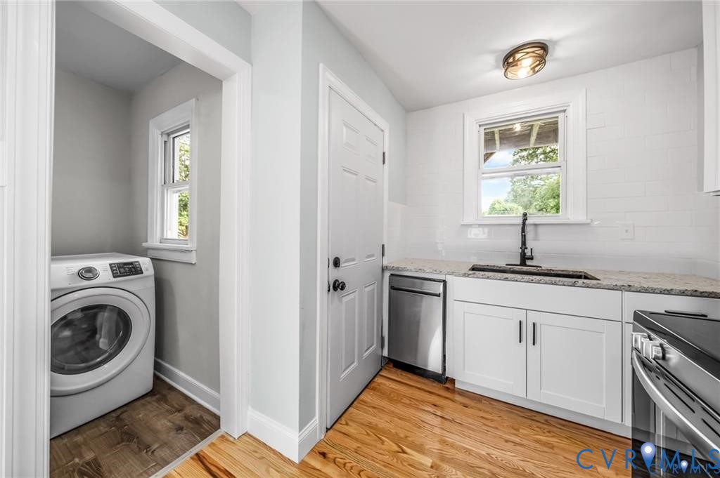 2105 Clarke Street Henrico, VA 23228 - Photo 7 of 26 a kitchen with stainless steel appliances granite countertop a sink and a window