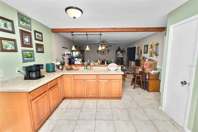 a kitchen with a sink appliances and cabinets