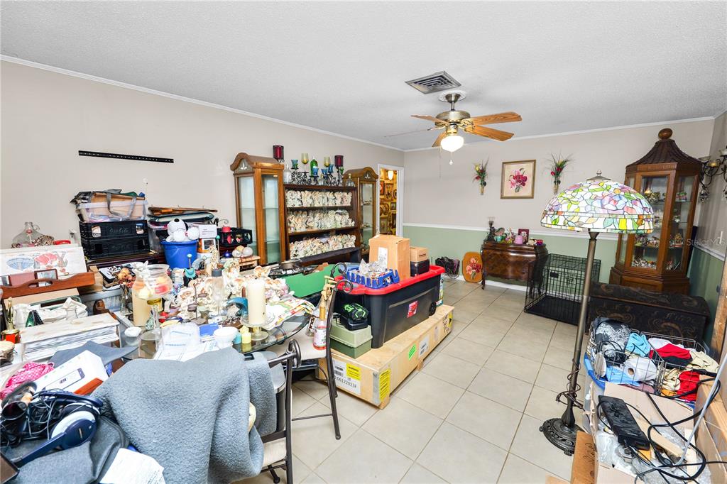 3075 Flamingo Lane Mulberry, FL 33860 - Photo 12 of 30 a living room with lots of furniture and toys