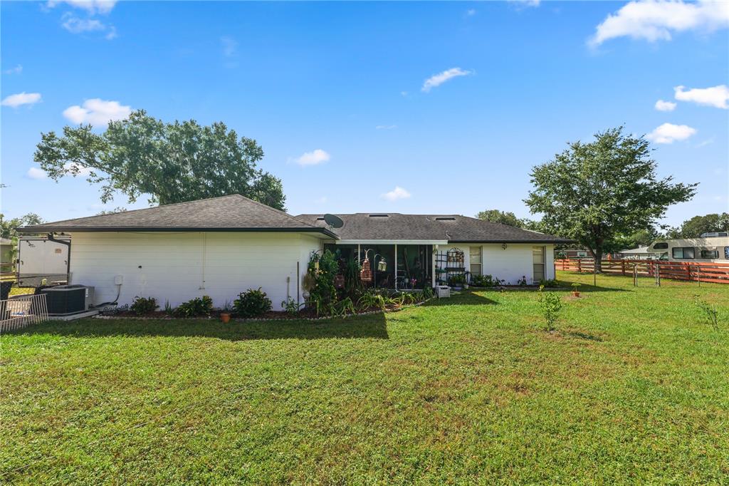 3075 Flamingo Lane Mulberry, FL 33860 - Photo 21 of 30 a view of a house with a yard