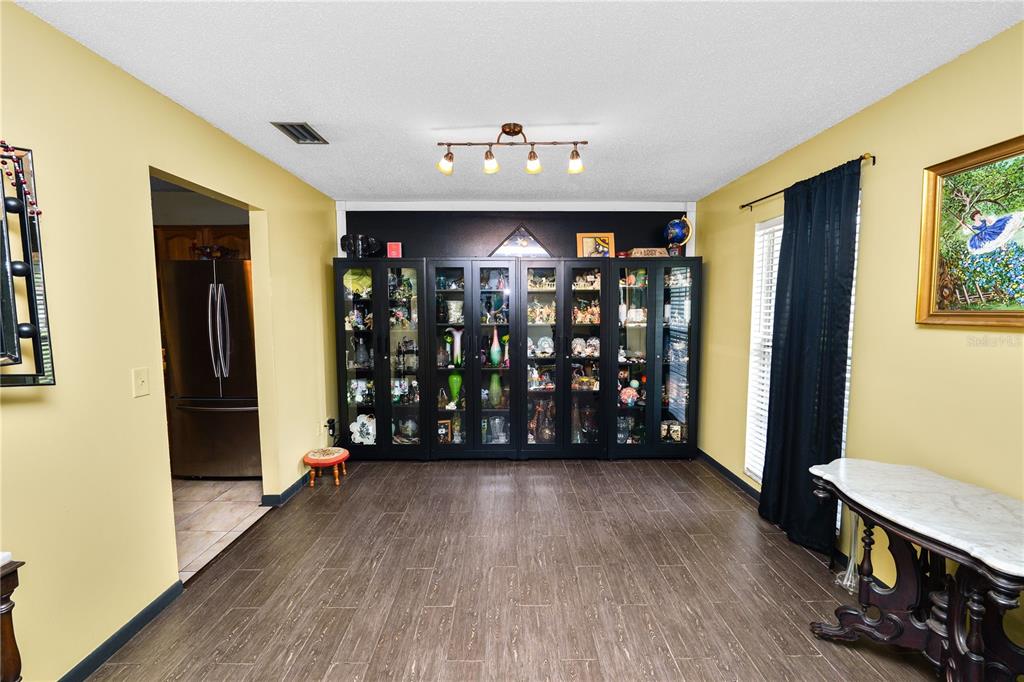 3075 Flamingo Lane Mulberry, FL 33860 - Photo 8 of 30 a view of an empty room with window and wooden floor