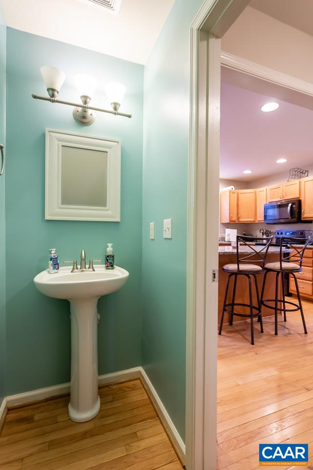 30 Amethyst Road Palmyra, VA 22963 - Photo 14 of 37 a bathroom with a sink and a mirror