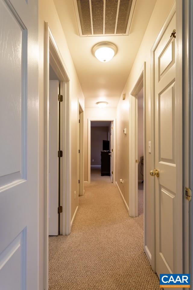 30 Amethyst Road Palmyra, VA 22963 - Photo 16 of 37 a view of a hallway with wooden shelves