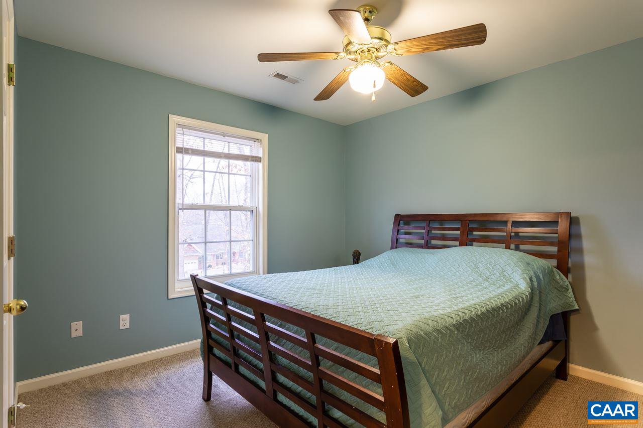 30 Amethyst Road Palmyra, VA 22963 - Photo 27 of 37 a bed sitting in a bedroom next to a window