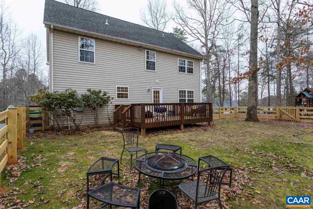 30 Amethyst Road Palmyra, VA 22963 - Photo 30 of 37 a view of a house with patio chairs and a table