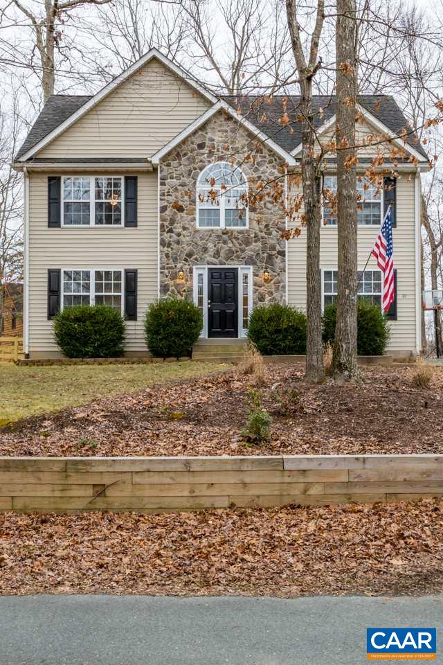 30 Amethyst Road Palmyra, VA 22963 - Photo 37 of 37 a view of a white house next to a yard with large trees