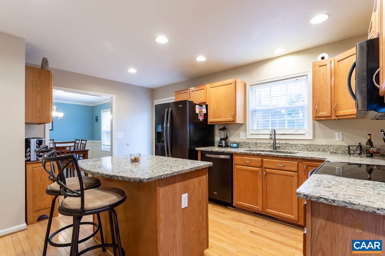 30 Amethyst Road Palmyra, VA 22963 - Photo 10 of 37 a kitchen with stainless steel appliances granite countertop sink stove top oven and microwave