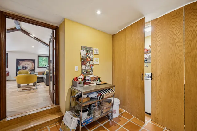 a view of a livingroom with furniture and a potted plant