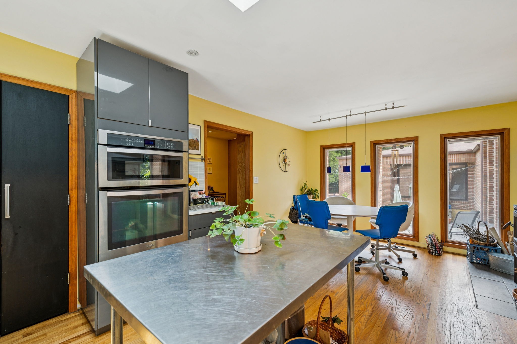 1030 Waller Road Brentwood, TN 37027 - Photo 37 of 90 a kitchen with a table chairs refrigerator and microwave