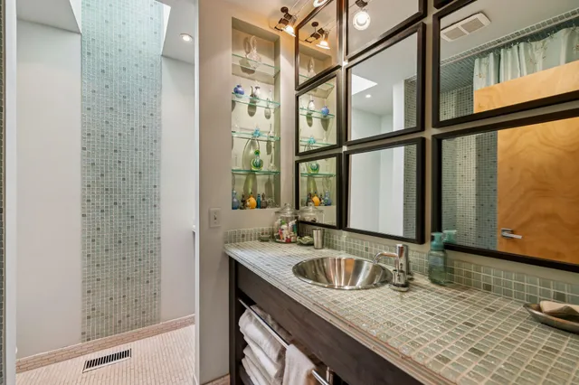 a kitchen with stainless steel appliances a stove a sink and cabinets
