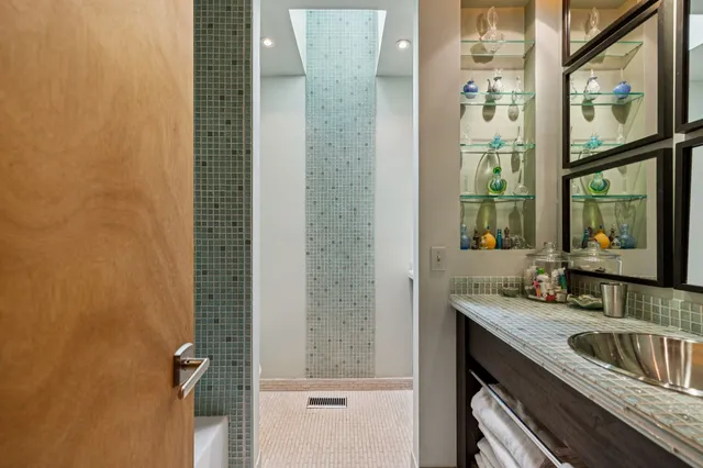 a view of a grassy field with trees in the background