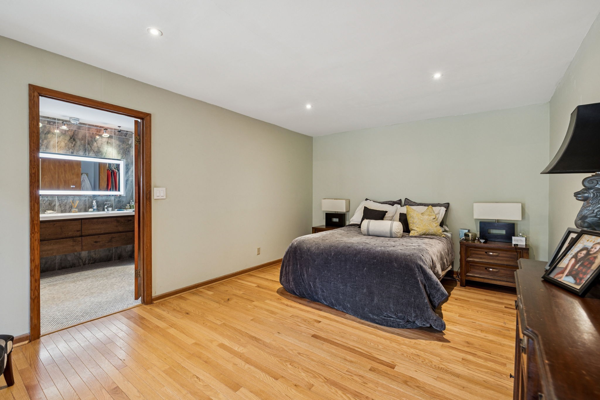 1030 Waller Road Brentwood, TN 37027 - Photo 56 of 90 a spacious bedroom with a bed and wooden floor