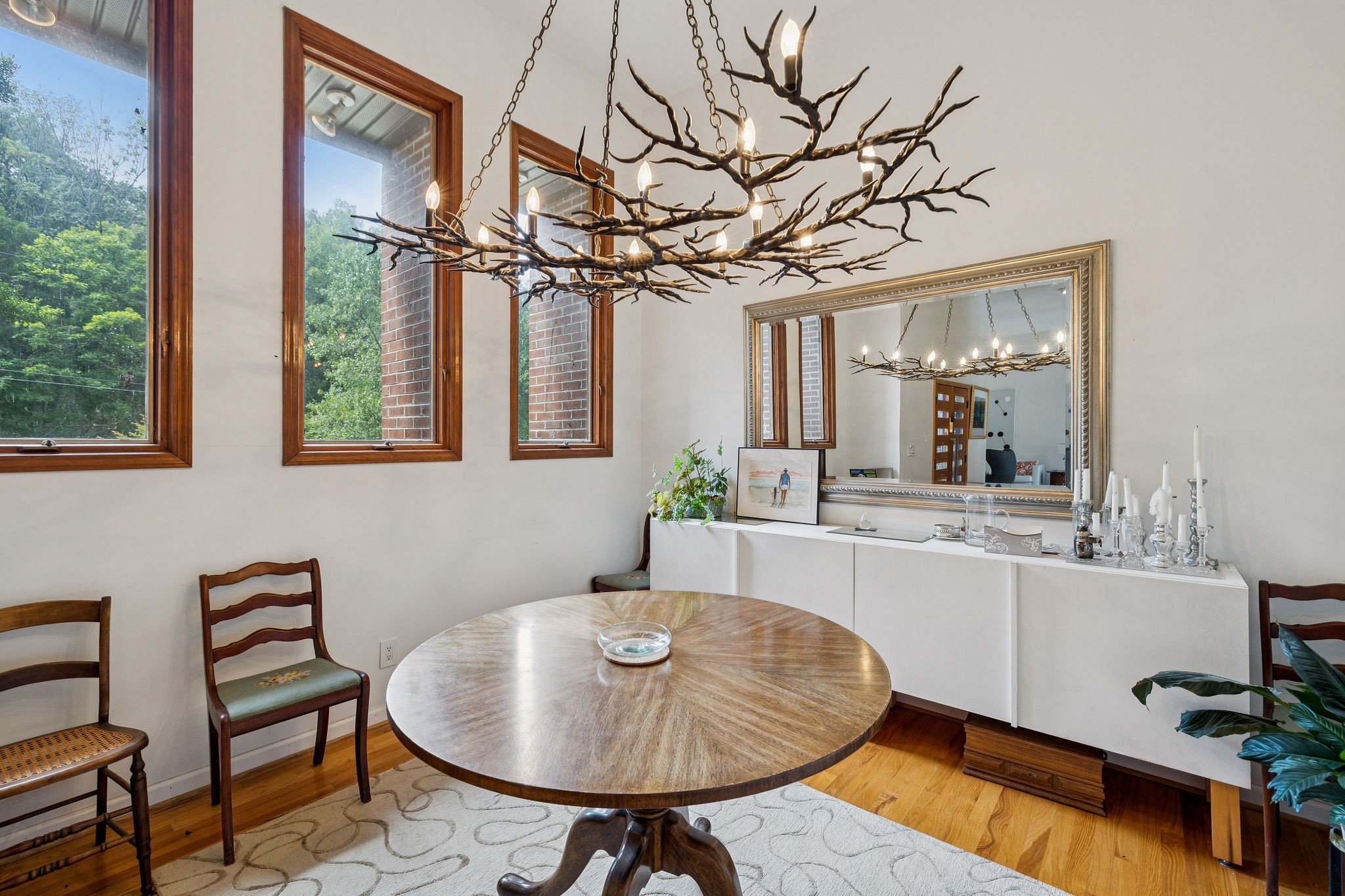 1030 Waller Road Brentwood, TN 37027 - Photo 60 of 90 a view of a dining room with furniture a chandelier and wooden floor