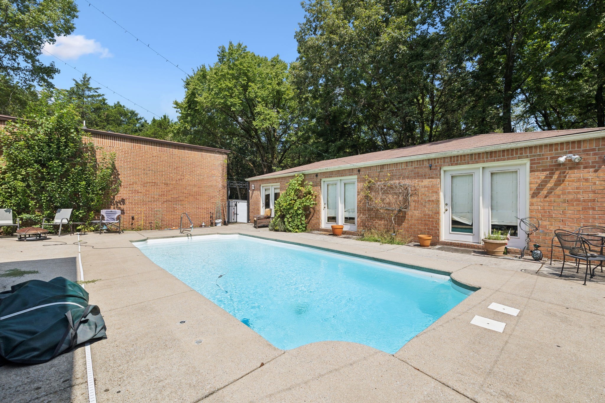 1030 Waller Road Brentwood, TN 37027 - Photo 67 of 90 a view of a house with swimming pool and sitting area