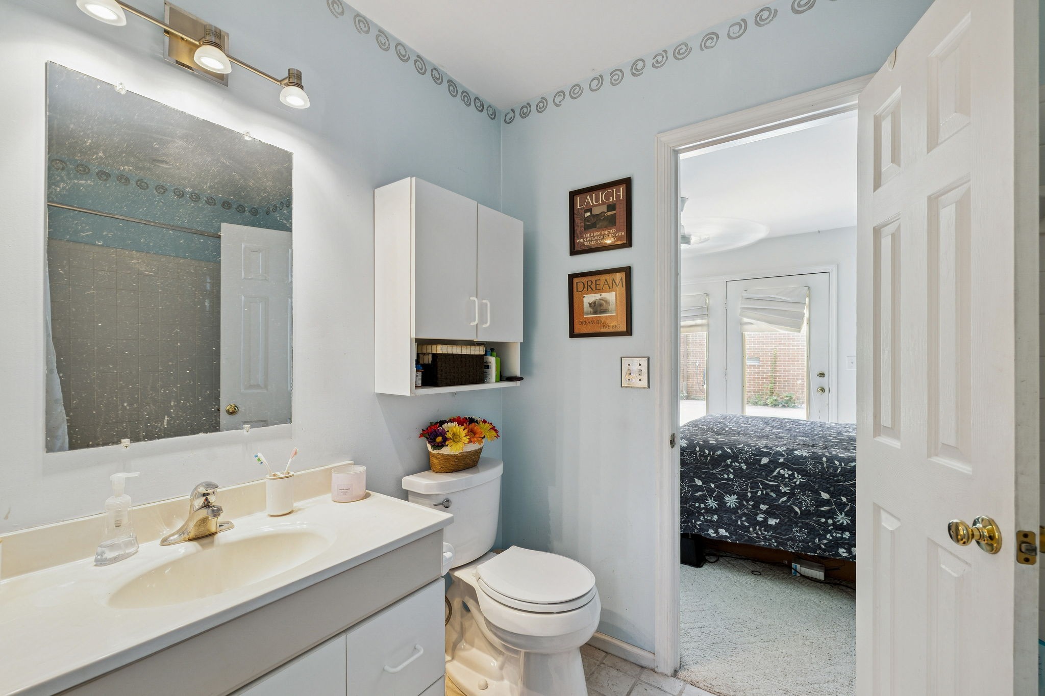 1030 Waller Road Brentwood, TN 37027 - Photo 74 of 90 a bathroom with a toilet sink and mirror