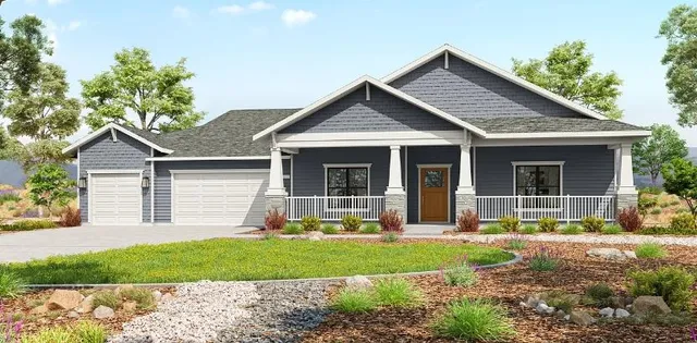 a front view of a house with a yard and porch