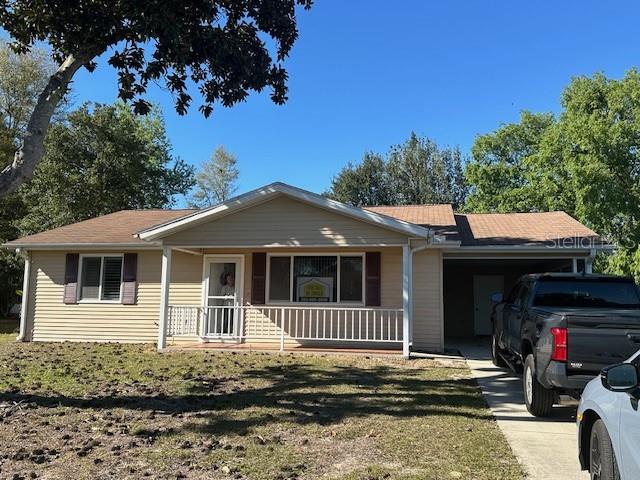 8545 Southwest 108th Place Ocala, FL 34481 - Photo 1 of 1 a front view of a house with a porch