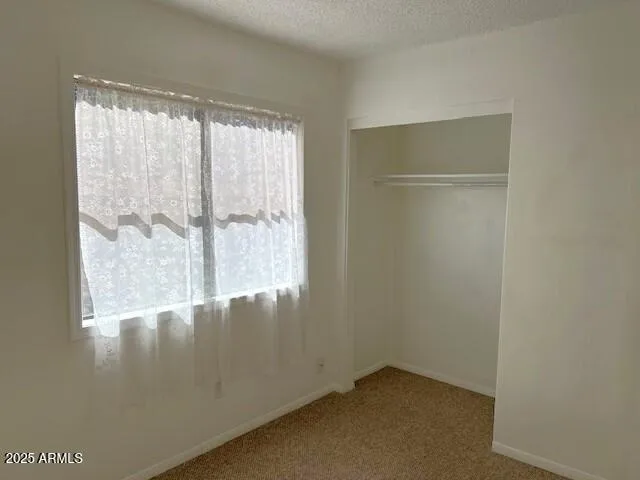 a bathroom with a toilet sink and shower