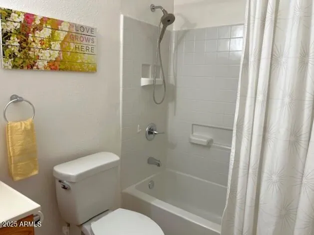 a bathroom with a sink vanity and toilet
