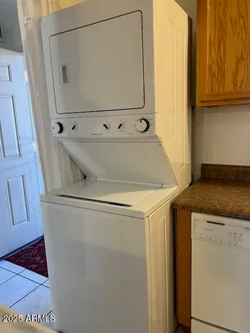 a view with a sink and cabinets