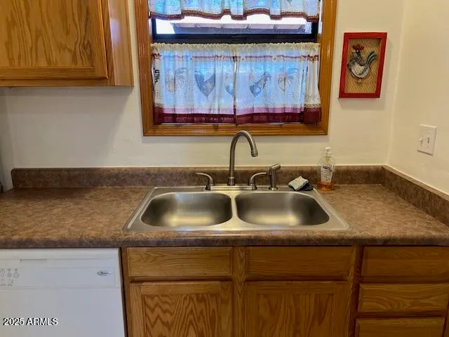 a white stove top oven sitting inside of a kitchen