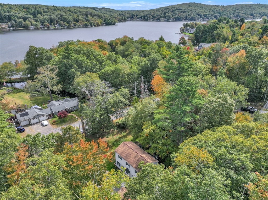 54 Mashapaug Road Holland, MA 01521 - Photo 4 of 42 an aerial view of a house with a yard and lake view