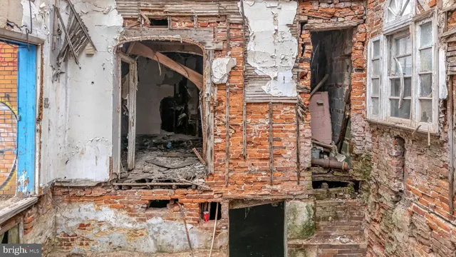 a view of fireplace with wooden floor