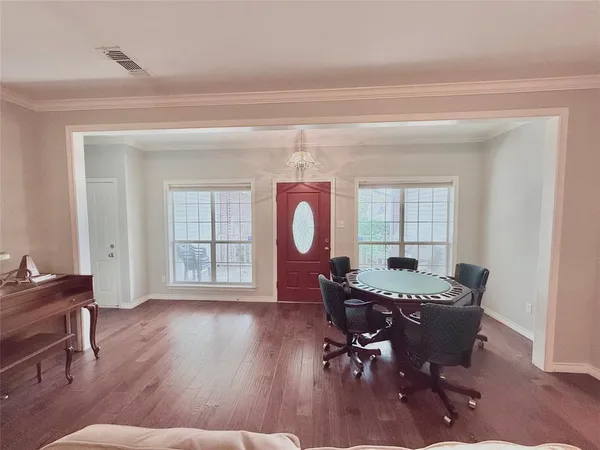 a workspace with furniture window and wooden floor