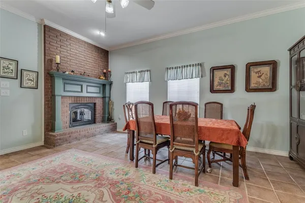a dining room with furniture and window