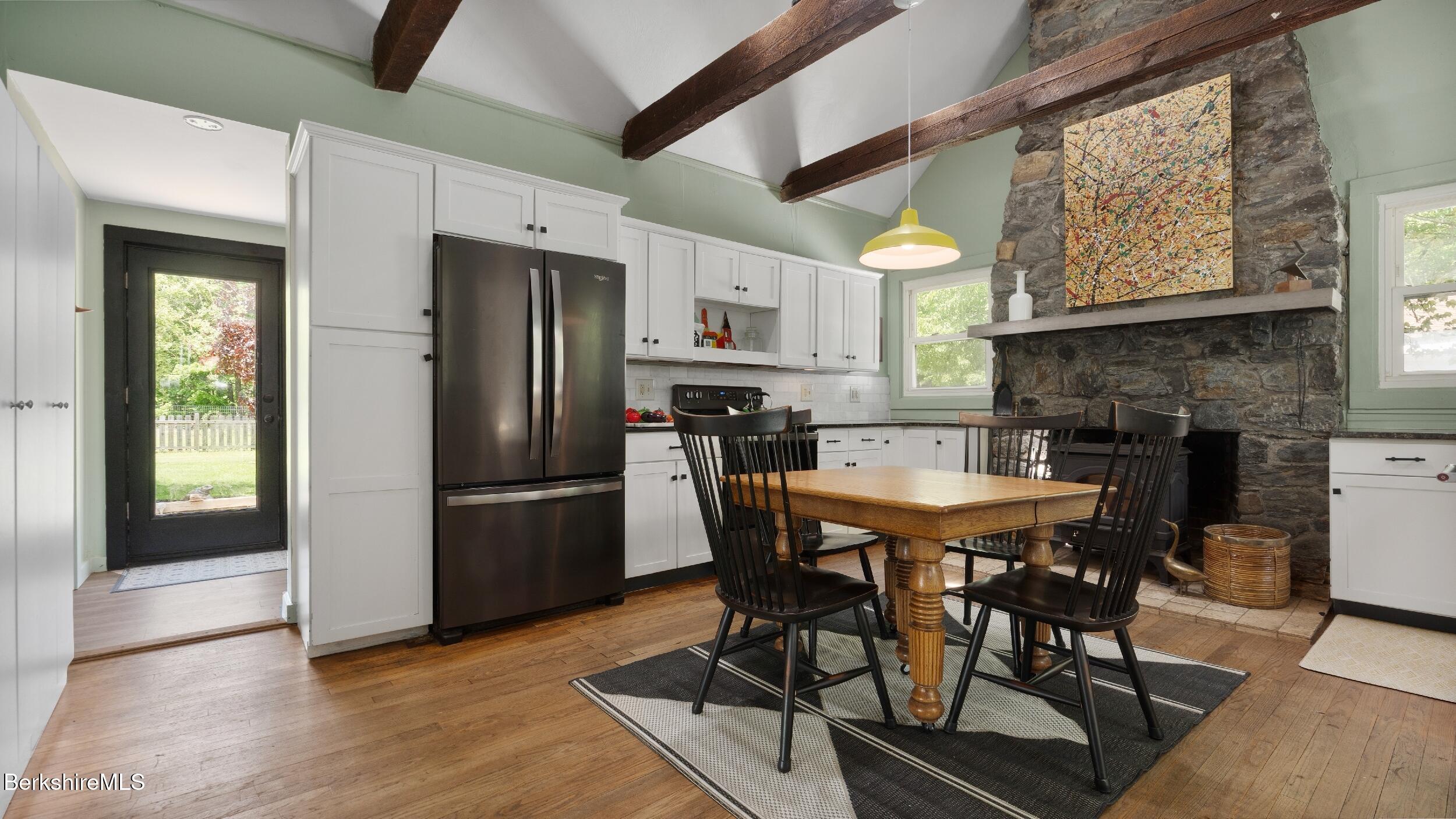 20 East Dugway Road Lenox, MA 01240 - Photo 53 of 84 a view of a dining room with furniture and a fireplace