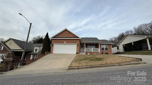 a front view of a house with yard