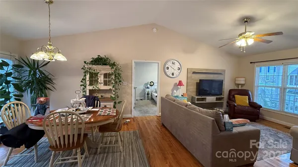 a view of a livingroom with furniture window and wooden floor