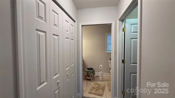a view of a bathroom from a hallway