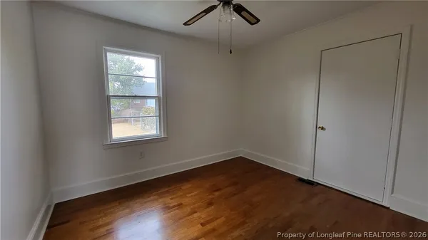 an empty room with a empty space and windows