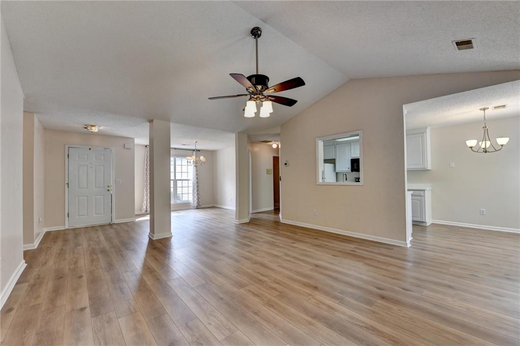 601 Bowling Lane Winder, GA 30680 - Photo 13 of 45 a view of an empty room with window and wooden floor
