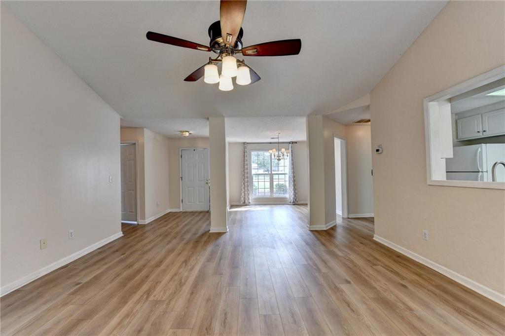 601 Bowling Lane Winder, GA 30680 - Photo 14 of 45 a view of an empty room with wooden floor and a window
