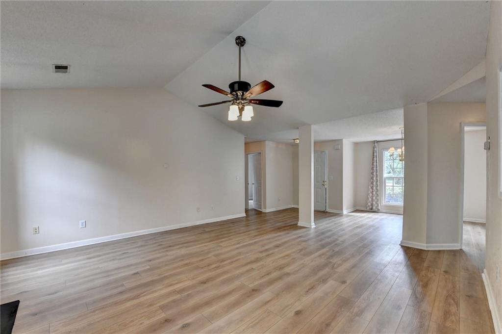 601 Bowling Lane Winder, GA 30680 - Photo 15 of 45 a view of room with wooden floor and ceiling fan