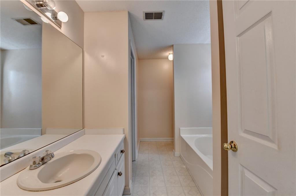601 Bowling Lane Winder, GA 30680 - Photo 30 of 45 a bathroom with a sink and a mirror