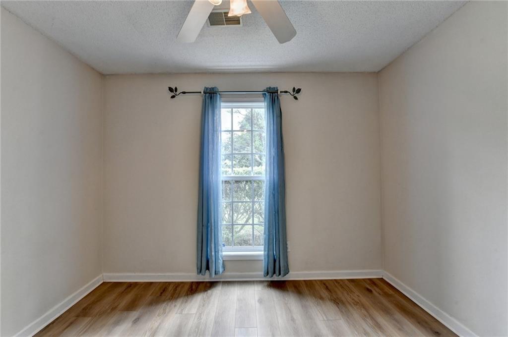 601 Bowling Lane Winder, GA 30680 - Photo 36 of 45 a view of room with hardwood floor and window