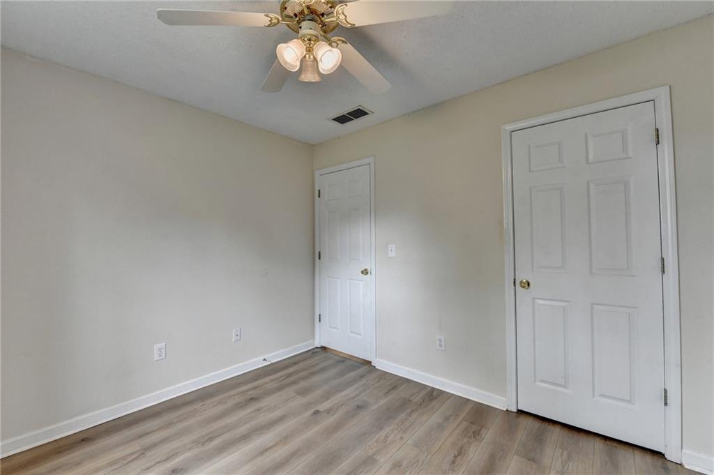 601 Bowling Lane Winder, GA 30680 - Photo 37 of 45 a view of an empty room with a fan