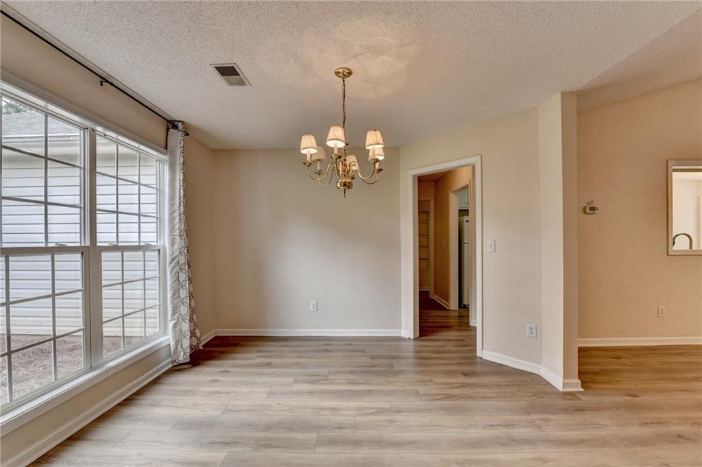 601 Bowling Lane Winder, GA 30680 - Photo 5 of 45 a view of a room with wooden floor and large window